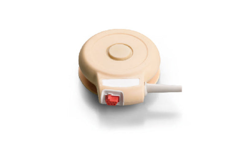 Beige medical device with a red light on a white background