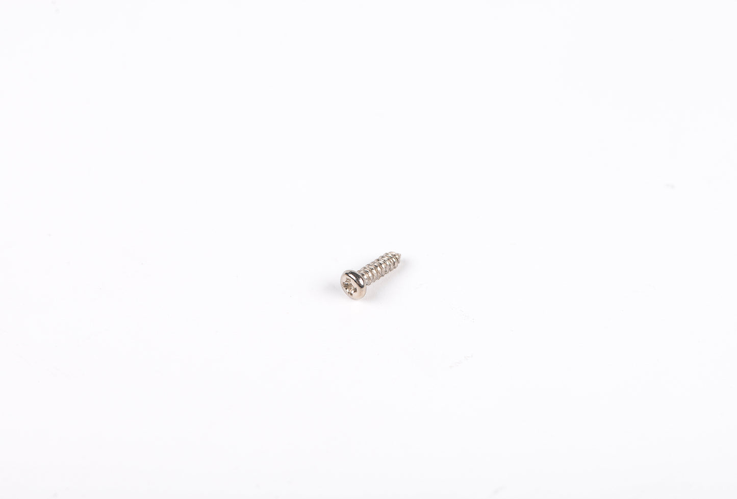Metal screw on a white background