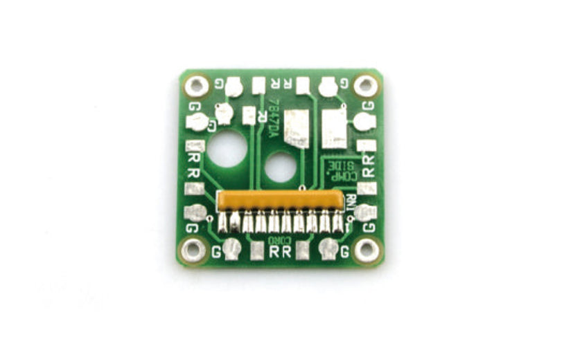 Green electronic circuit board with various components on a white background