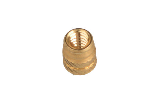Gold threaded metal insert on a white background