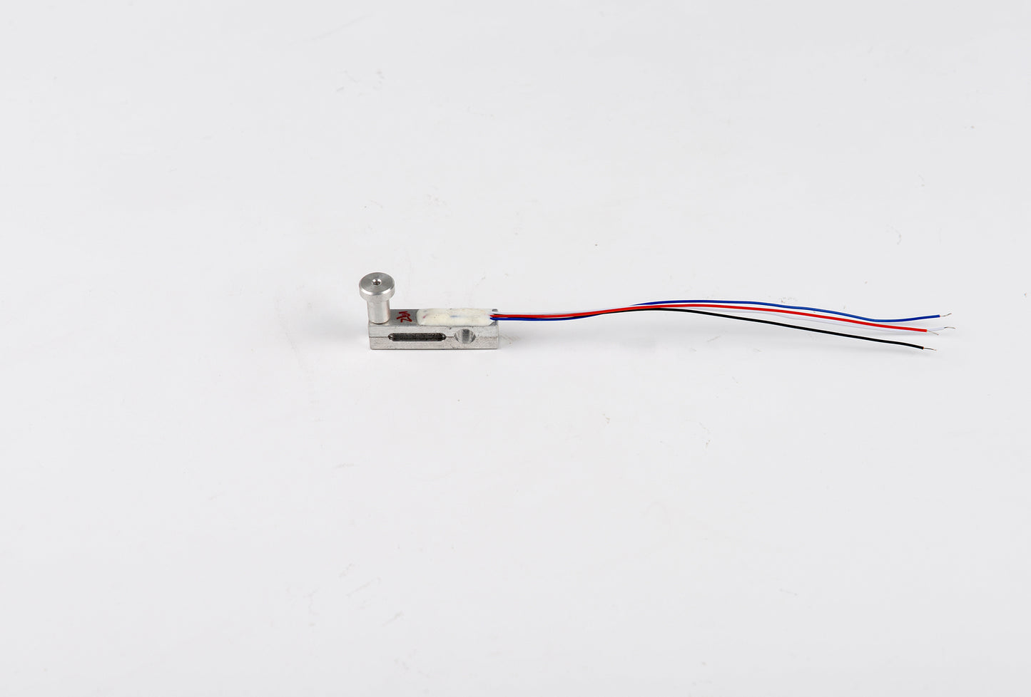 Small electronic component with wires on a white background