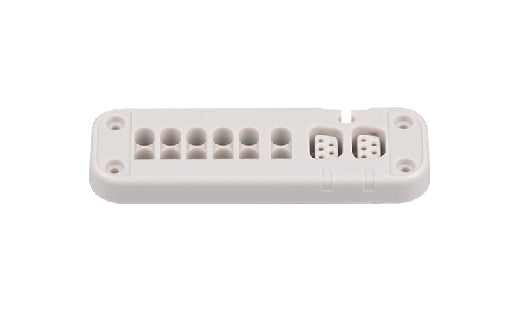 White electronic component with multiple holes on a white background