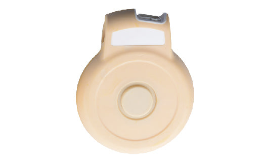Beige medical device on a white background