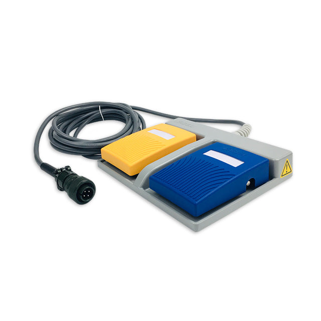 A double pedal footswitch with a blue and yellow mat, connected by a cable, with a safety warning label and a USB port.