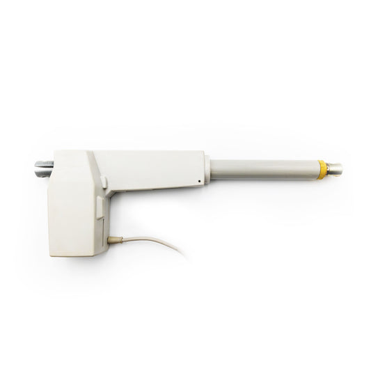 A Hillrom compatible DC drive for a VersaCare bed, primarily white in color with a yellow detail on the extendable foot section.