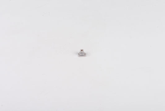 Small metallic object on a white background