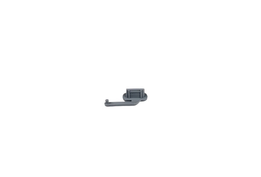 Small metallic object on a white background