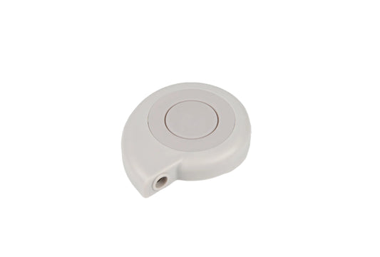 Round white object with a central circular component on a light gray background
