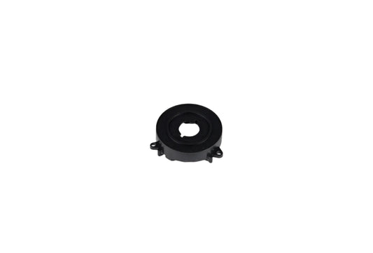 Black mechanical component on a white background