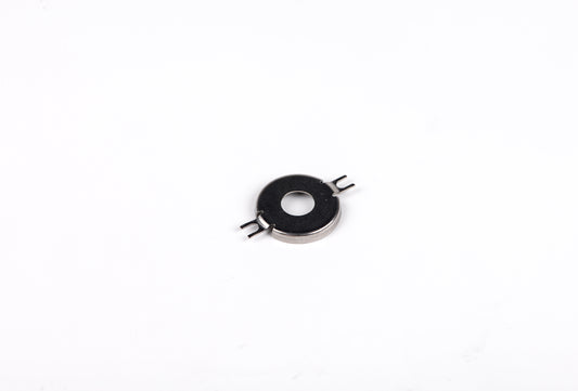 Small metallic component on a white background