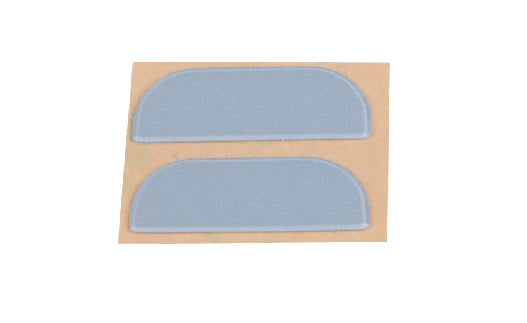 Two blue covers on a cardboard backing