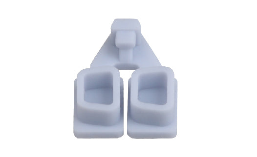 Three white plastic components stacked on a white background