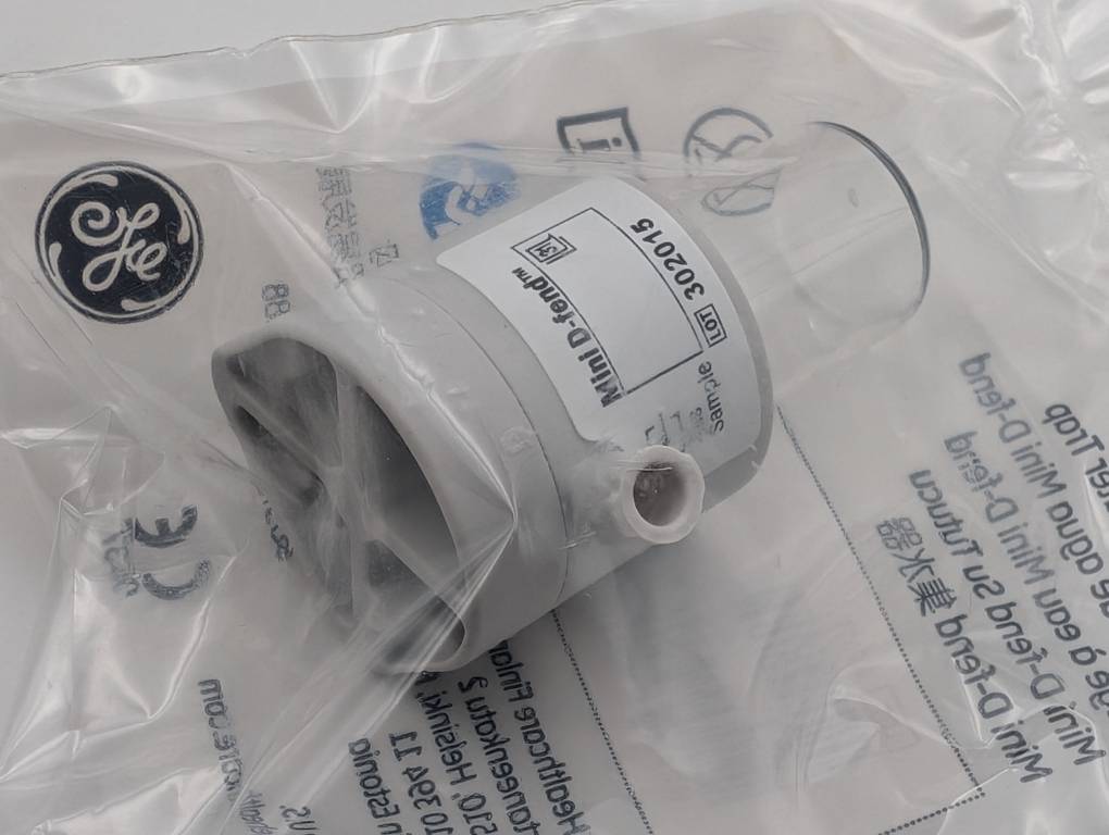 GE branded mechanical component on a white background