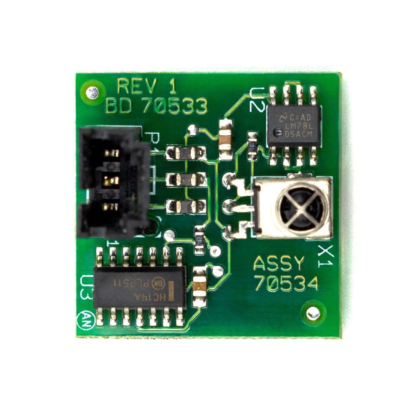 A green printed circuit board (PCB) for an IR detector assembly, with various electronic components such as capacitors, connectors, and integrated circuits visible.