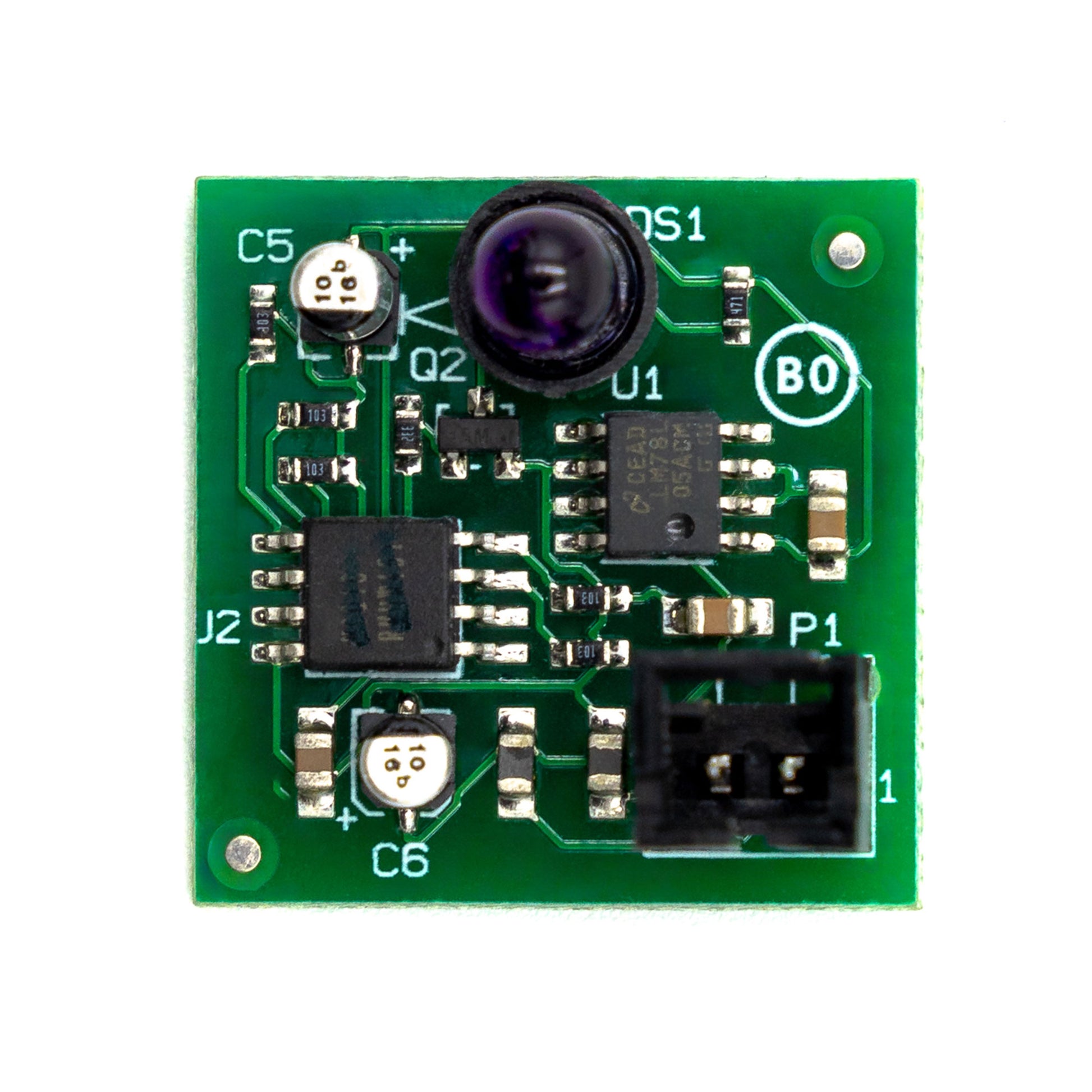 A green air circuit board with electronic components including resistors, capacitors, and a microchip.