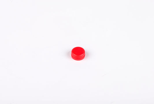 Small red object on a white background