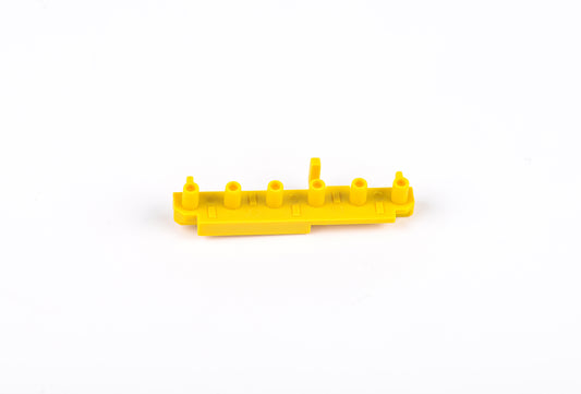 Yellow plastic component on a white background