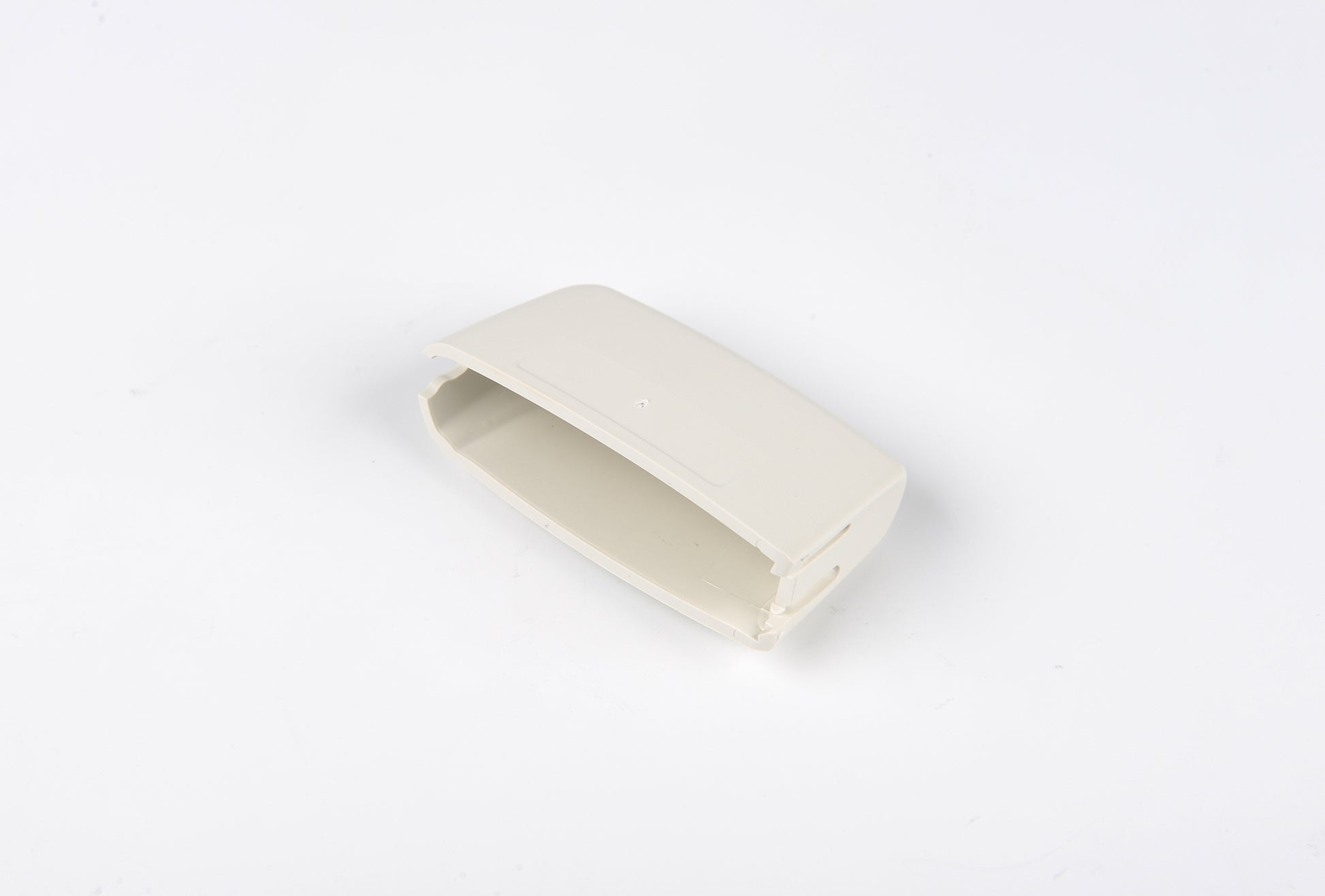 Beige rectangular object on a white background