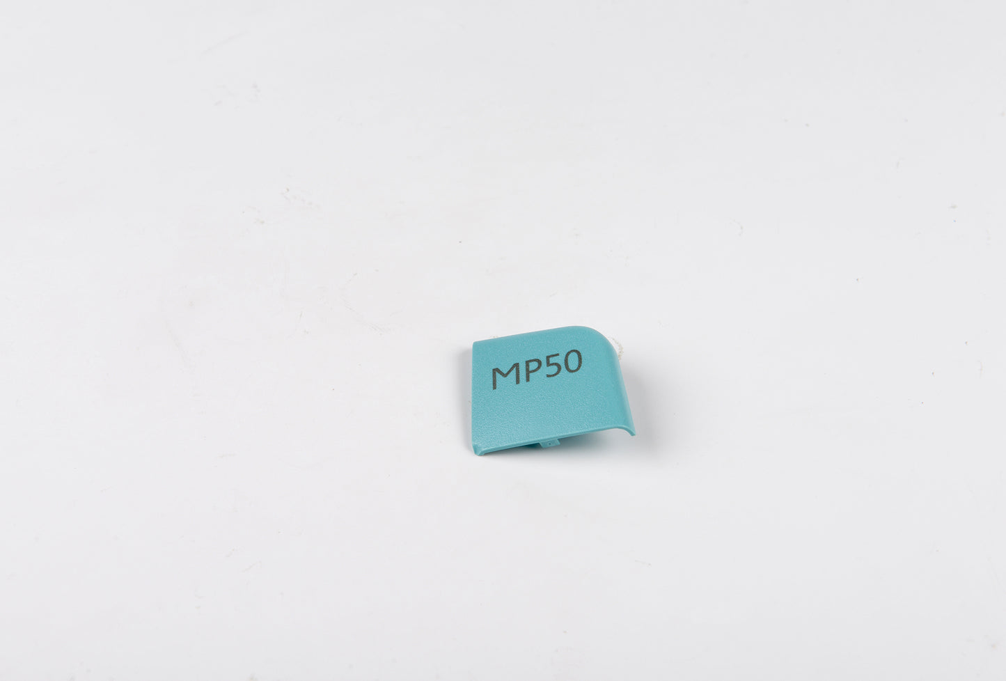 Small blue rectangular label with 'MP50' text on a light gray background