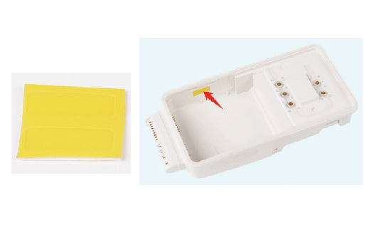 White medical device with a yellow patch on a light blue background