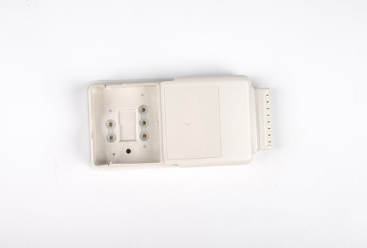 White plastic component on a white background