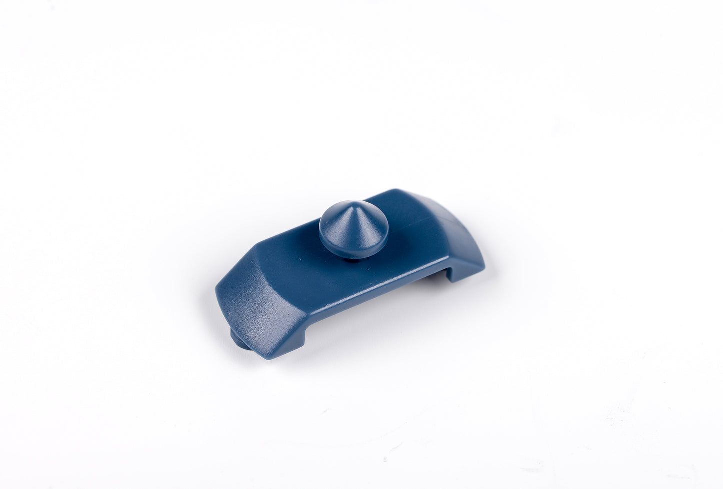 Blue plastic component on a white background