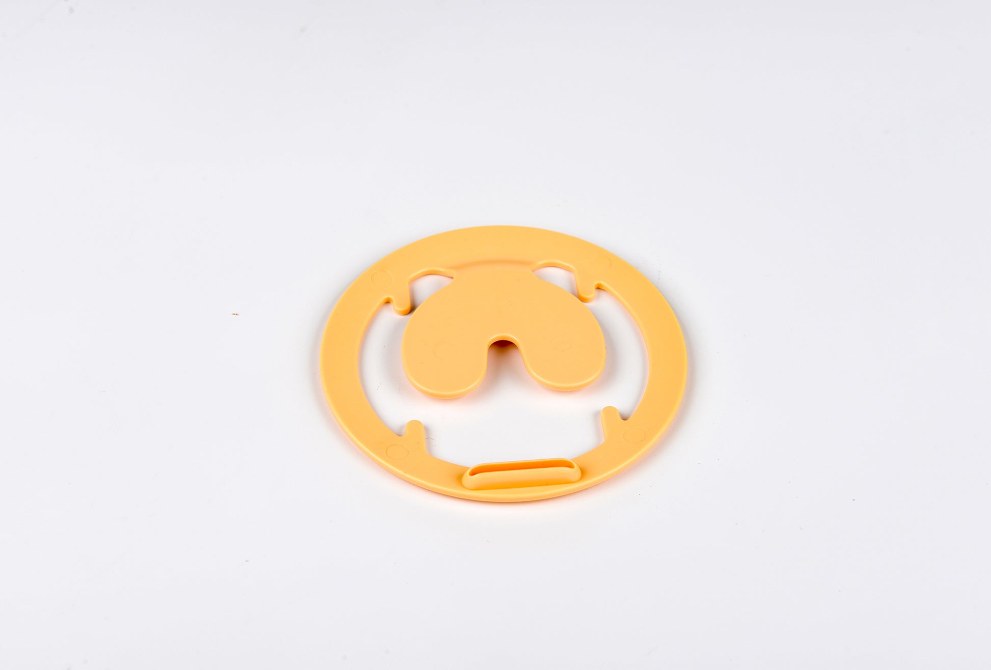 Yellow plastic component on a white background