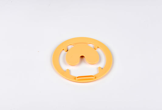 Yellow plastic component on a white background