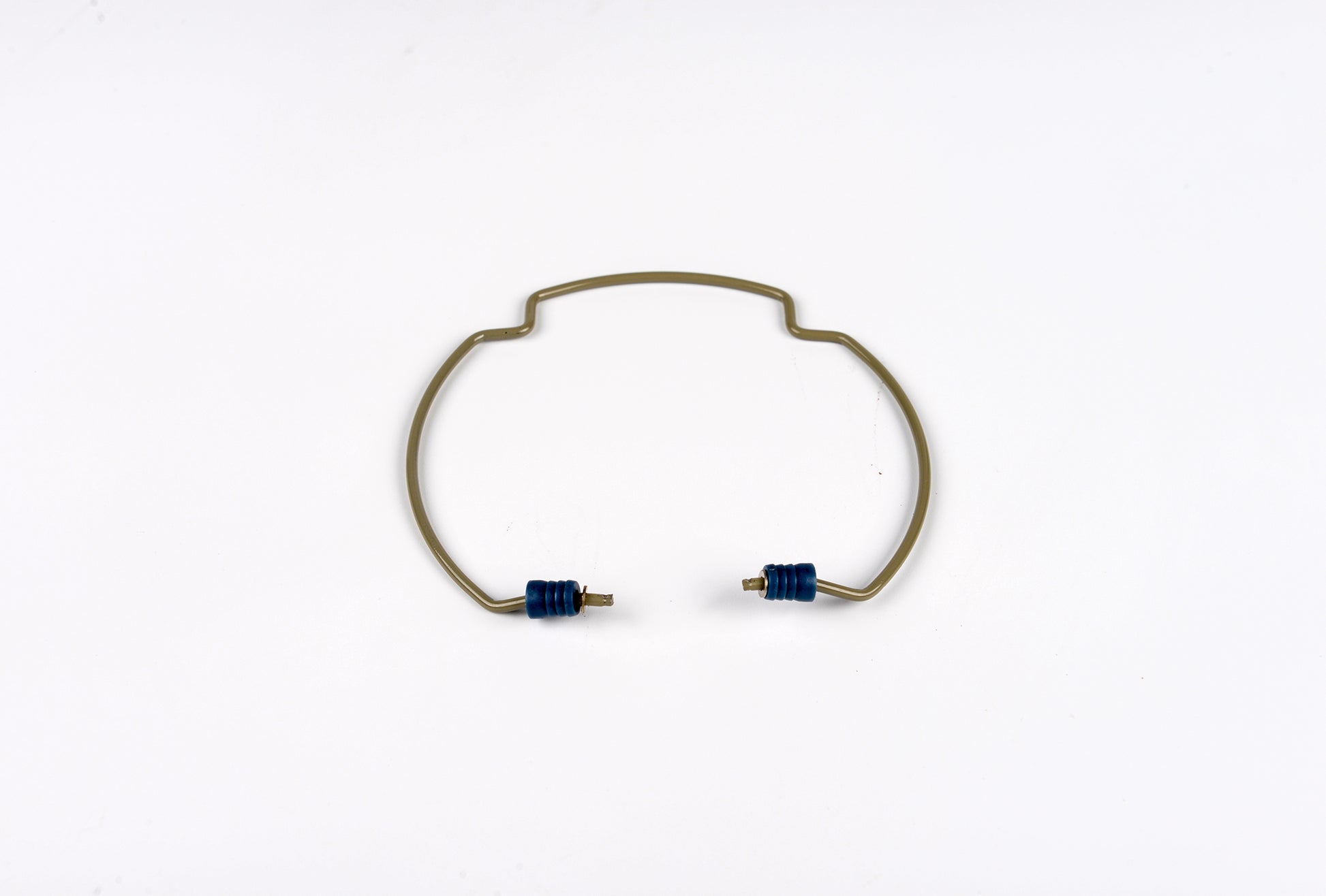 Gold bracelet with blue stones on a white background
