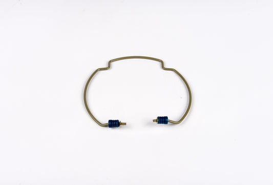 Gold bracelet with blue stones on a white background