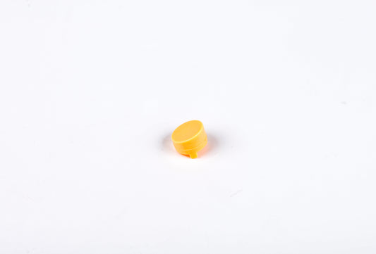 Small yellow object on a white background